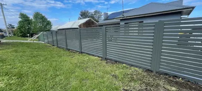 Front yard in North Melbourne with slat aluminium fencing